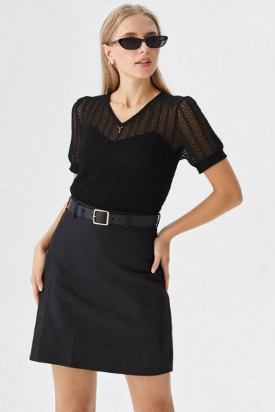 Woman wearing black knit casual top with black high-waist pants – western wear for women
